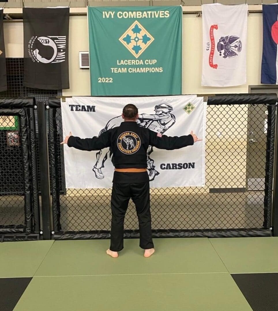 A man standing in front of a banner