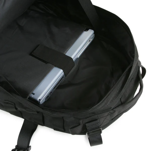 A laptop in the middle of a backpack.